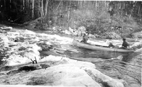 canoe shooting rapids