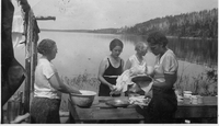 chlo and ladies washing dishes on sandy bay