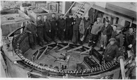 group of men in generator housing