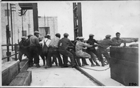 muskeG island gang of men pulling rope