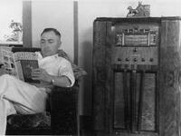 Marvin Huffaker beside radio