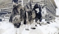 Two unidentified men, the one in the center may be a pilot man on far right is DB McGilvary 1930 