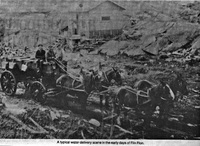 A typical water delivery scene in the early days of Flin Flon
