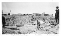 Drilling Rock with HBM&S Bunkhouses In Background C 1929