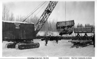 Unloading Dump Cars-Marion Crane in Foreground ( Possibly at Mile 86 C 1929)