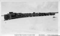 Linn Tractor Pulling Load Of Dump Cars And Caboose To Island Falls (C 1929/30)