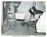 Sister St. Martin Stoking Furnace AT Flin Flon General Hospital- No Date