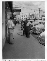 Installing Parking Meters On Main Street - August 1950